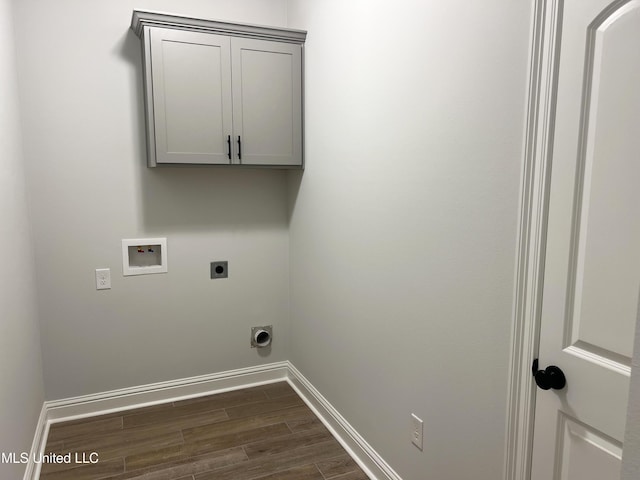 washroom featuring dark wood-type flooring, electric dryer hookup, hookup for a washing machine, and baseboards