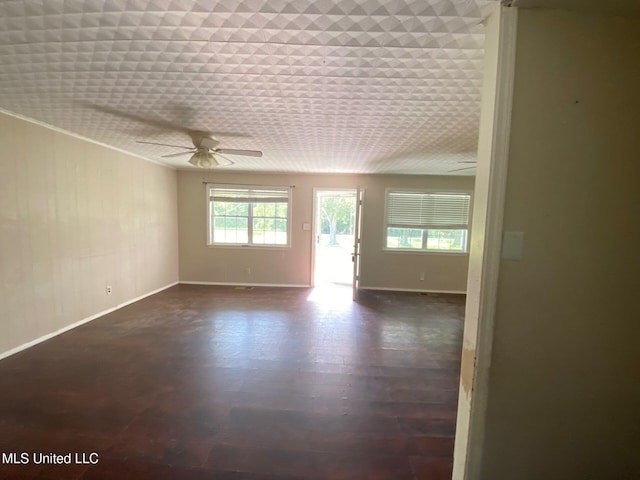 410 N Brooks St, Pelahatchie, MS 39145 - spare room featuring a ceiling fan and dark wood-style floors