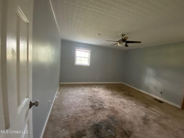 410 N Brooks St, Pelahatchie, MS 39145 - carpeted spare room with baseboards and ceiling fan