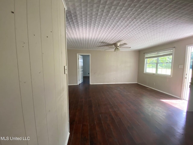 410 N Brooks St, Pelahatchie, MS 39145 - unfurnished room featuring a ceiling fan and dark wood-style flooring