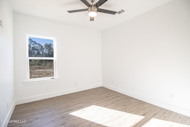 unfurnished room featuring ceiling fan and hardwood / wood-style floors