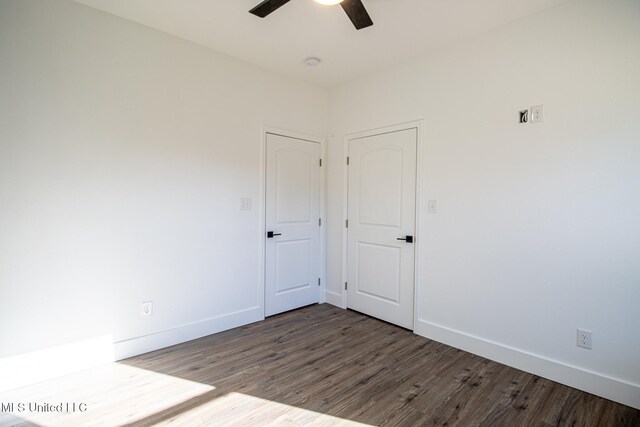 spare room with hardwood / wood-style flooring and ceiling fan