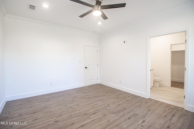 unfurnished room featuring ceiling fan, wood-type flooring, and ornamental molding