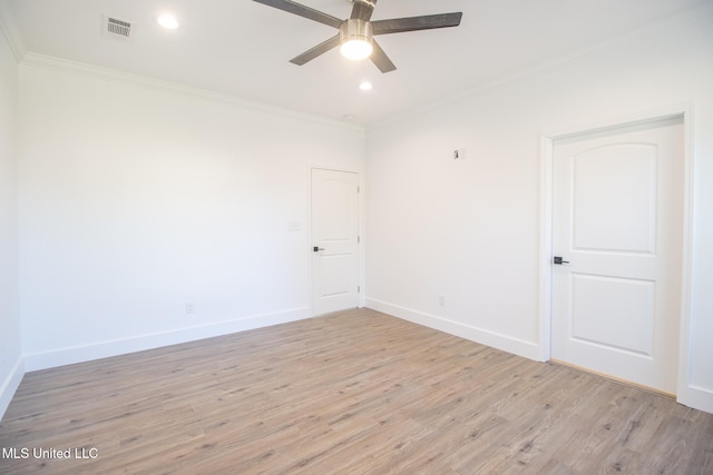 empty room with crown molding, light hardwood / wood-style flooring, and ceiling fan