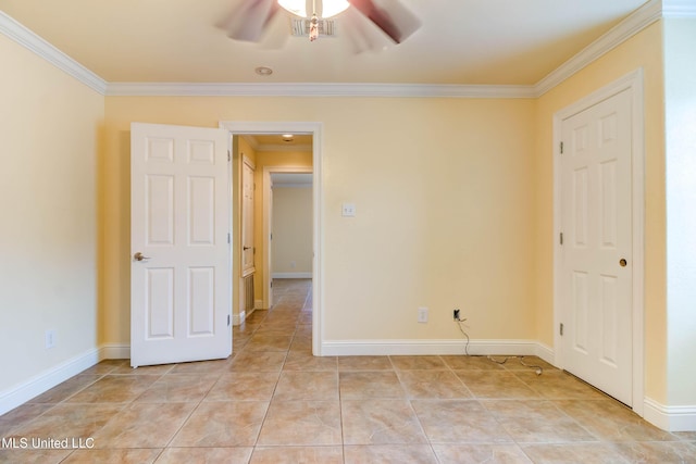 unfurnished bedroom with light tile patterned floors, baseboards, visible vents, and crown molding