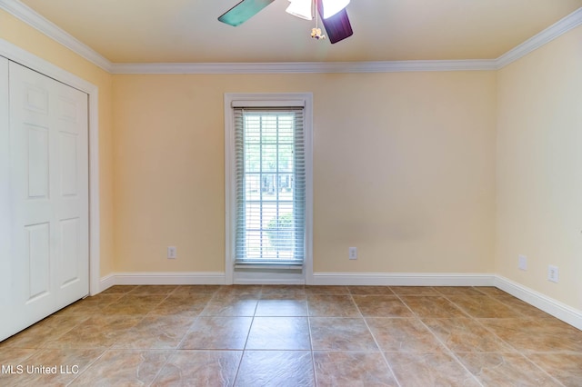 interior space with crown molding, a ceiling fan, and plenty of natural light