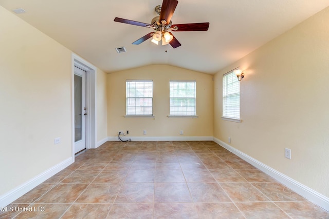 unfurnished room featuring a ceiling fan, visible vents, baseboards, lofted ceiling, and light tile patterned flooring