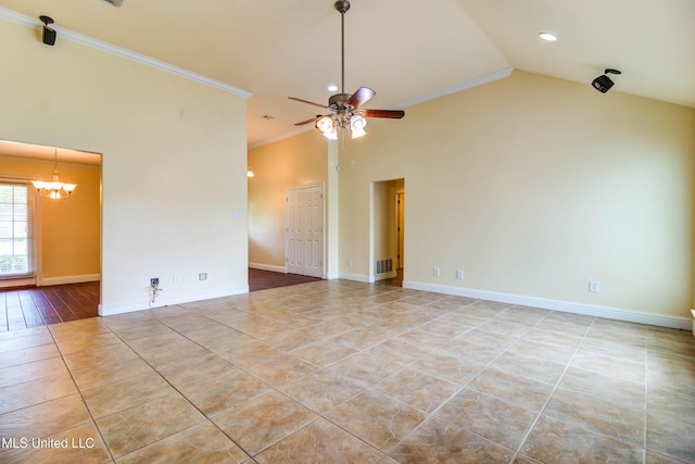 tiled spare room with ceiling fan with notable chandelier, recessed lighting, vaulted ceiling, crown molding, and baseboards