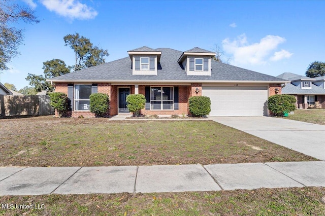 view of front of property with a front lawn and a garage