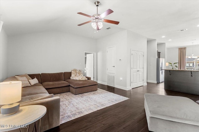 living room with ceiling fan and dark hardwood / wood-style flooring