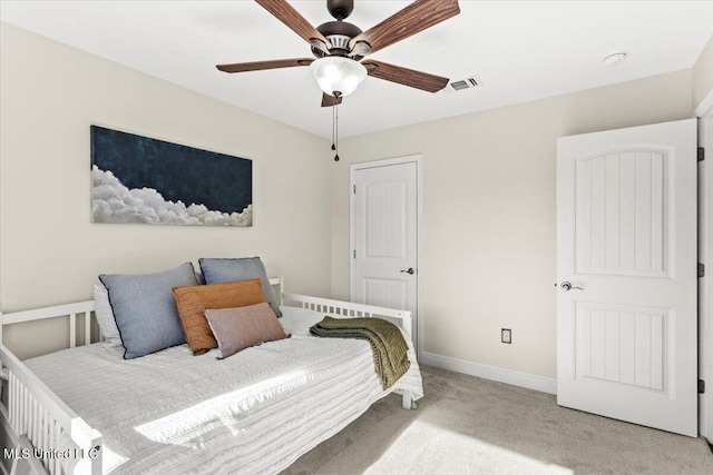 carpeted bedroom with ceiling fan