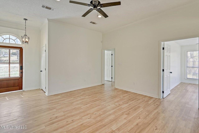 interior space with visible vents, baseboards, and light wood-style floors