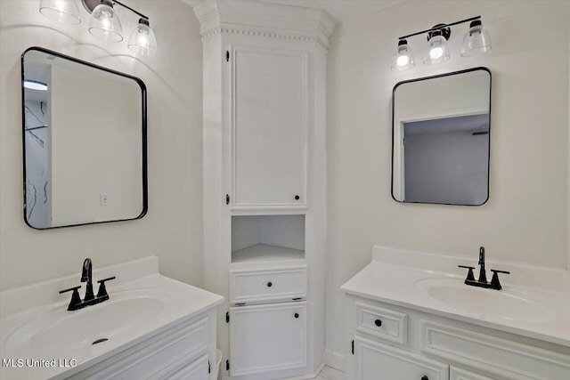 bathroom with a sink and two vanities