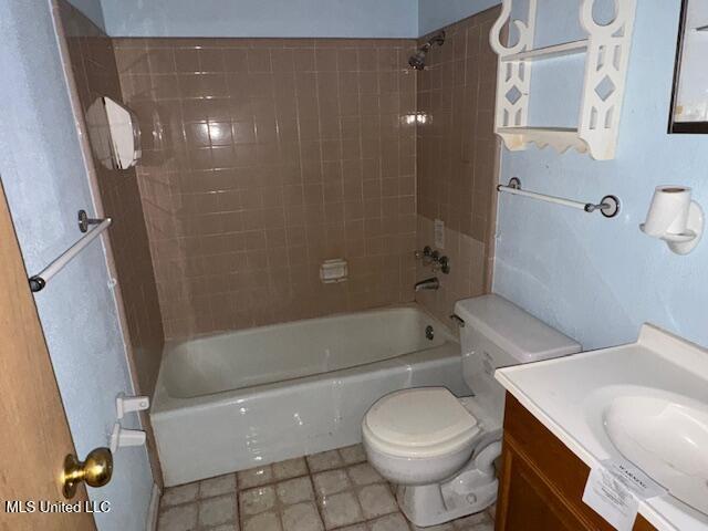 full bath featuring vanity, toilet, and bathing tub / shower combination
