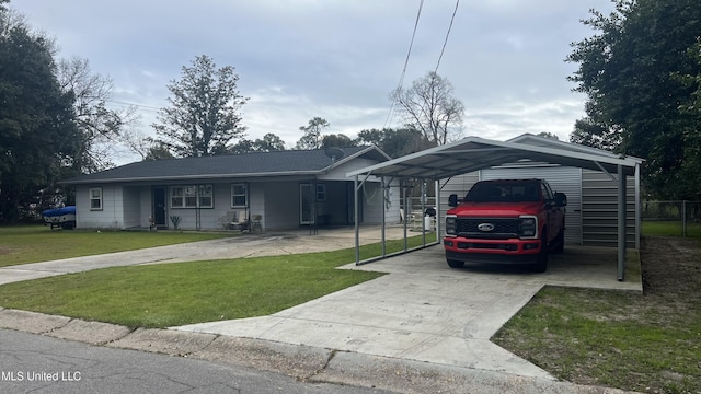 ranch-style house with driveway and a front lawn