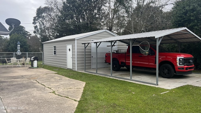 view of parking / parking lot featuring a carport and fence