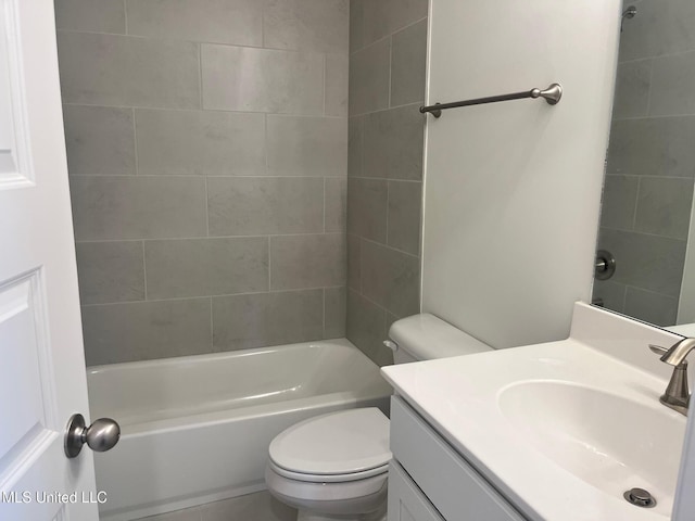 bathroom featuring toilet, vanity, and shower / washtub combination
