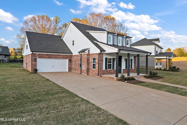 view of front facade featuring covered porch, a garage, and a front yard