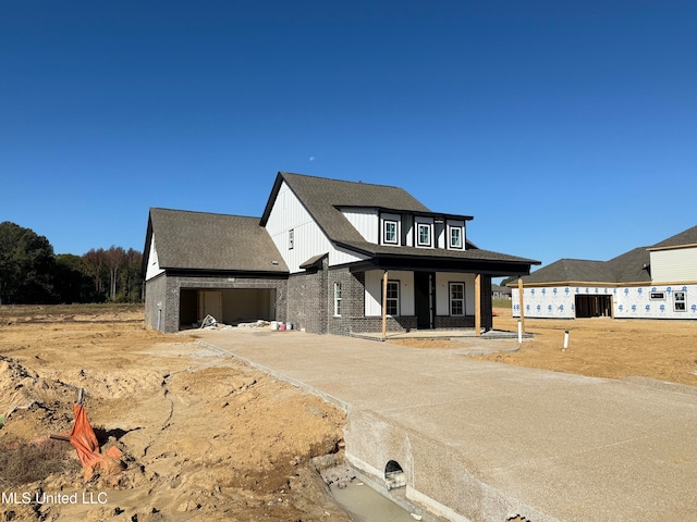 view of front of home featuring a garage and covered porch