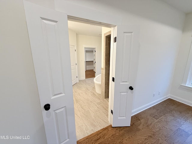 corridor featuring light hardwood / wood-style flooring