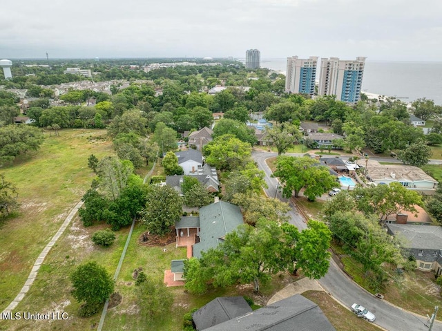 birds eye view of property with a water view