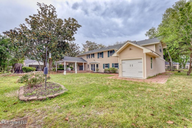 view of front of house with a garage and a front lawn