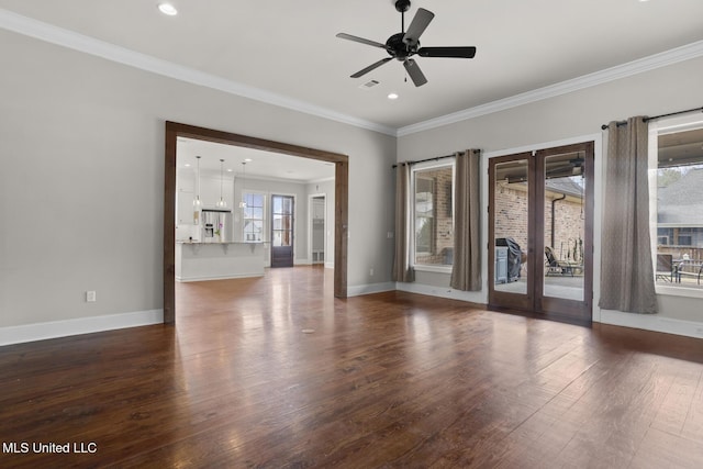 unfurnished room with crown molding, baseboards, and dark wood-style flooring