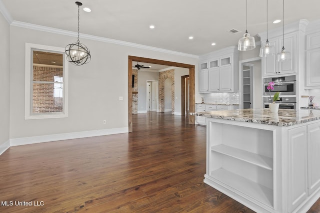 kitchen featuring stainless steel double oven, open shelves, dark wood finished floors, and white cabinetry