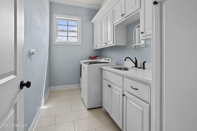 laundry room featuring independent washer and dryer, a sink, cabinet space, light tile patterned floors, and baseboards