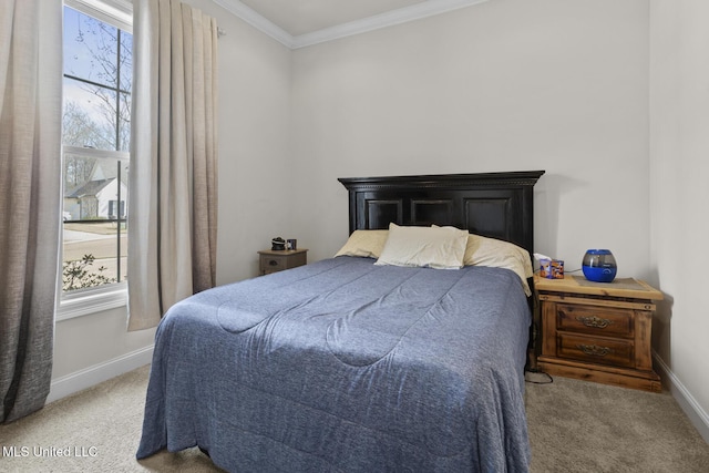 carpeted bedroom featuring baseboards and ornamental molding