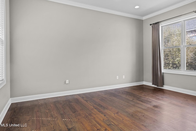 empty room featuring recessed lighting, dark wood-style floors, baseboards, and ornamental molding