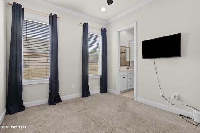 unfurnished bedroom featuring baseboards, recessed lighting, light carpet, crown molding, and connected bathroom