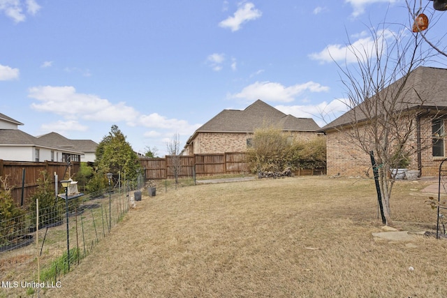 view of yard featuring a fenced backyard