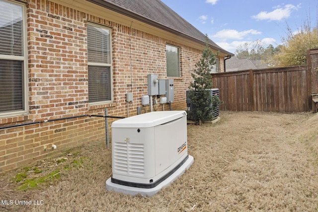 exterior details featuring brick siding, fence, central AC unit, and a power unit