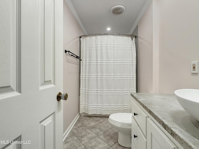 bathroom with toilet, vanity, tile patterned floors, and ornamental molding