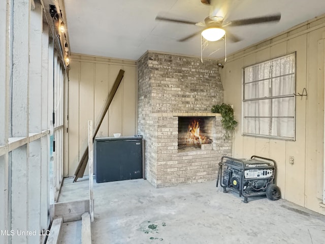 miscellaneous room featuring a fireplace and ceiling fan