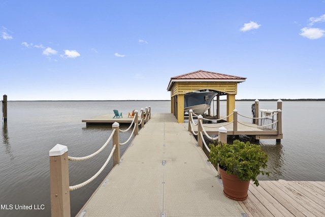 dock area featuring a water view and boat lift