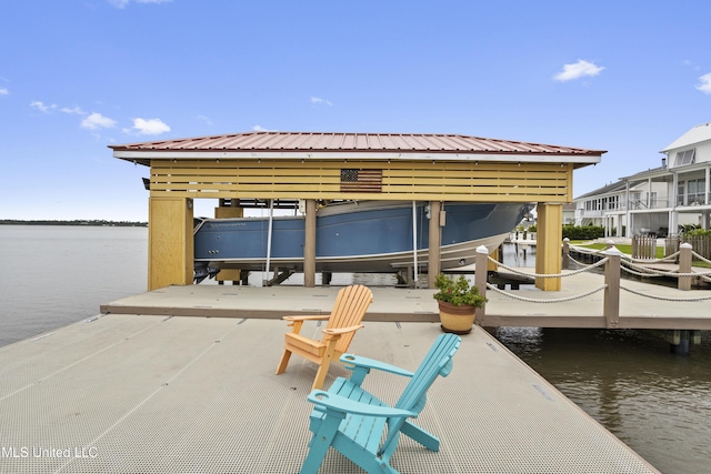 dock featuring boat lift and a water view