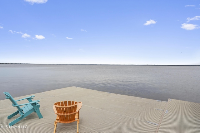 view of patio with a water view