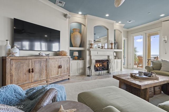 living area featuring light tile patterned flooring, recessed lighting, a fireplace with flush hearth, built in features, and ceiling fan