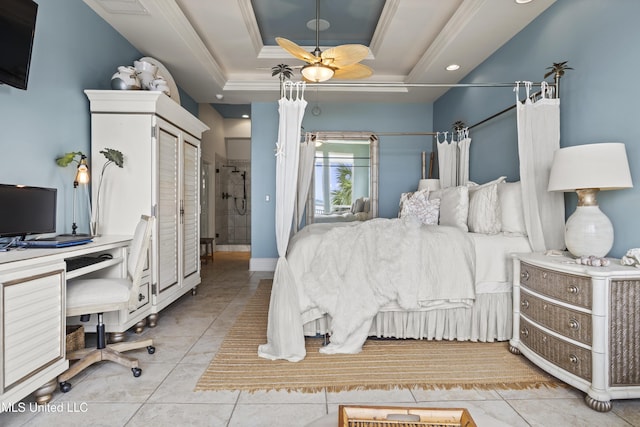 bedroom featuring an office area, light tile patterned flooring, crown molding, and a tray ceiling