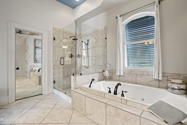 bathroom featuring a shower stall, a jetted tub, and tile patterned floors