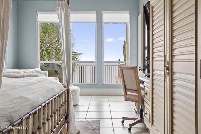 bedroom featuring light tile patterned flooring
