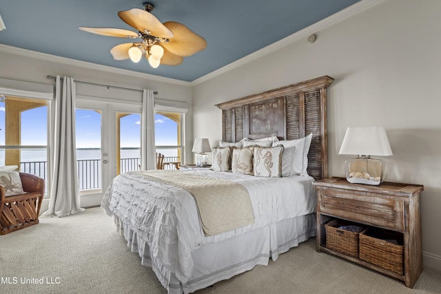 bedroom featuring carpet flooring, access to outside, ornamental molding, a water view, and a ceiling fan