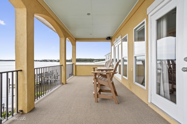 balcony featuring a water view