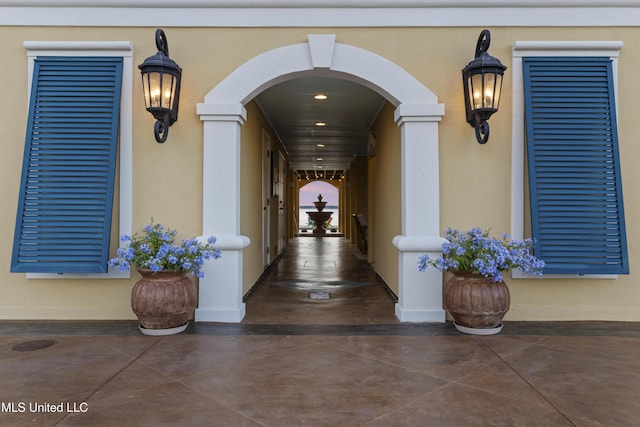 property entrance with stucco siding