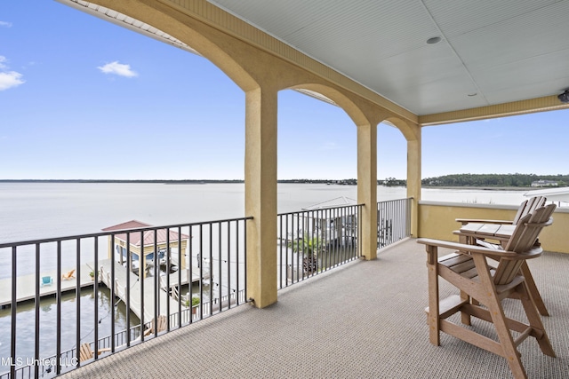 balcony featuring a water view