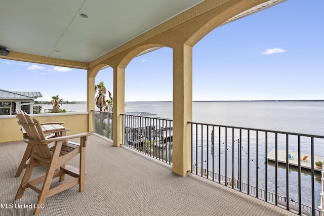 balcony featuring a water view