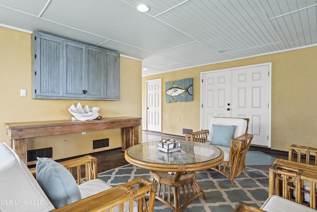 dining room with wood ceiling and recessed lighting