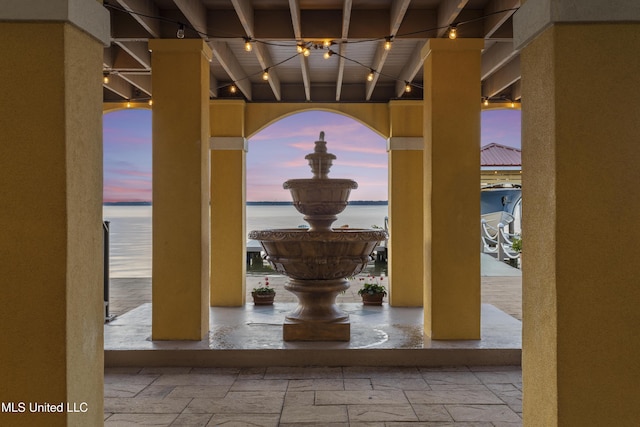 patio terrace at dusk with a water view